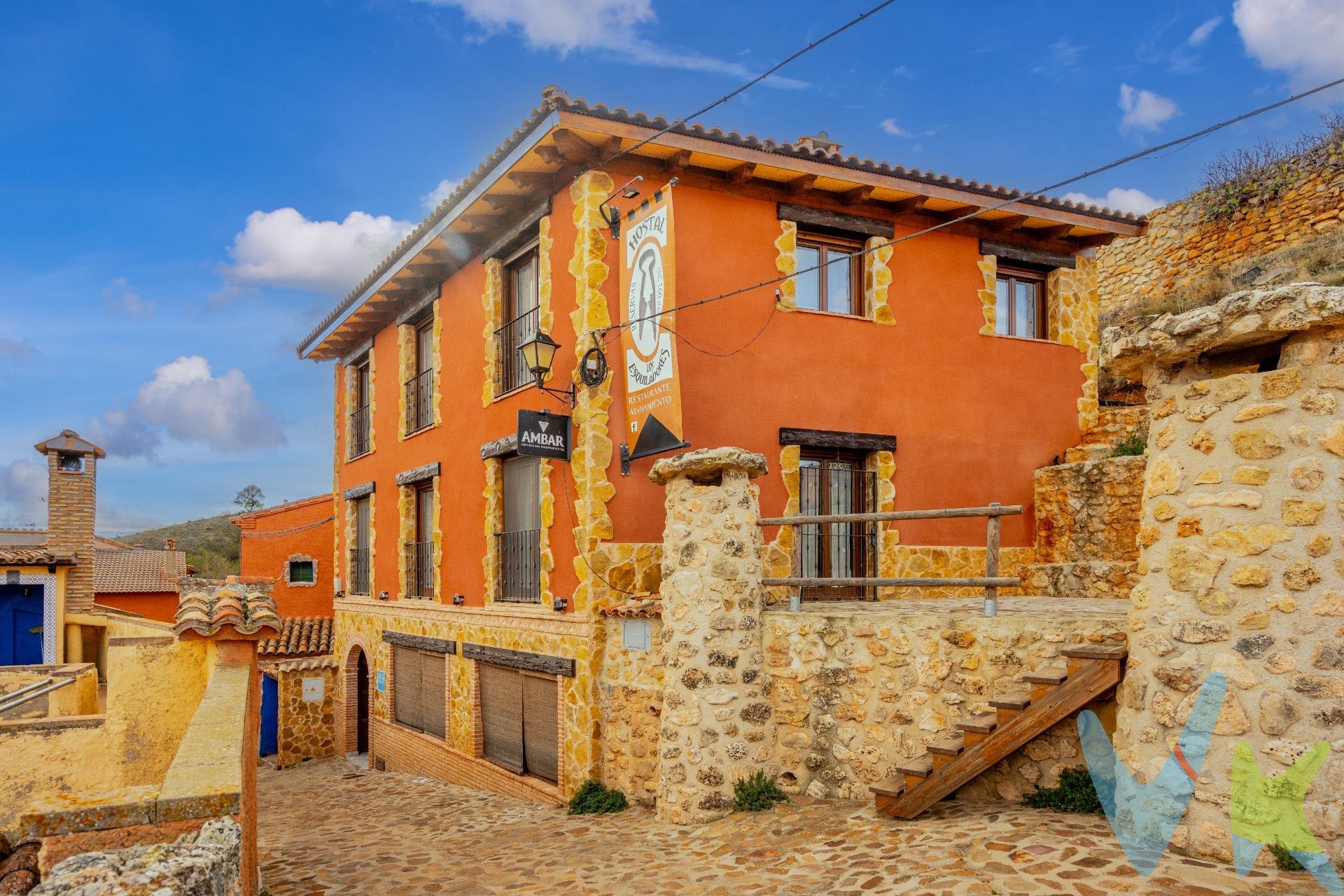 ¡Te invitamos a descubrir el encanto de este impresionante  hostal en Anento, considerado uno de los pueblos más bonitos de España! . El  hostal se vende con licencia y con todos los accesorios necesarios para poner en marcha tú negocio. Consta de 275 m2 construidos en tres plantas, cada una de ellas con espacios diseñados para brindarte una experiencia cómoda y placentera. En la planta baja, con un total de 101m2, encontrarás el acogedor restaurante, ideal para disfrutar de deliciosos platos locales, con capacidad para 26 comensales. El restaurante cuenta con aire acondicionado para garantizar tu comodidad durante todo el año. Además, el techo está equipado con aislante térmico, lo que proporciona un ambiente agradable y confortable incluso en los días más calurosos o fríos. También en la planta baja, se encuentran la cocina totalmente equipada, dos cuartos de baño adicionales para mayor comodidad de nuestros huéspedes, incluido baño para minusválidos, una bodega que se utiliza también como almacén y desde esa planta,  salida a una terraza privada. En la primera planta, con 87m2,  tenemos de dos amplias habitaciones con cuarto de baño completo. Estas habitaciones han sido decoradas con cuidado y atención al detalle para crear un ambiente acogedor y relajante. Cada una cuenta con todas las comodidades necesarias para una estancia agradable. En la segunda planta, con 87m2, otras dos habitaciones igualmente espaciosas, cada una con su propio cuarto de baño completo. Una de estas habitaciones está equipada con un estupendo jacuzzi, donde podrás sumergirte y relajarte después de un día explorando los encantos de Anento. En esta planta también encontramos una zona de lavandería. La calefacción es por gasoil y por placas solares, teniendo suelo radiante en el hostal. El  hostal es el lugar perfecto para aquellos que desean disfrutar de la belleza y tranquilidad de uno de los pueblos más bonitos de España, y descubrir todo lo que este maravilloso pueblo y la provincia de Zaragoza tienen para ofrecer. También se puede adquirir como vivienda ya que tiene todo lo necesario para ello. Anento es un encantador pueblo ubicado en la provincia de Zaragoza, en España. Es conocido por su belleza y encanto medieval, lo que le ha valido el reconocimiento como uno de los pueblos más bonitos de España. Sus calles empedradas, casas de piedra y arquitectura medieval te transportarán a otra época. El pueblo está rodeado por un entorno natural impresionante, con colinas y montañas que ofrecen vistas panorámicas espectaculares. Uno de los principales atractivos de Anento es el paraje de Aguallueve, denominado el monte que llora. El paseo circular que sale y llega a Anento lleva a esta minúscula cascada sobre roca y musgo que asombra con el termómetro sobre cero y cautiva cuando se hiela, es un lugar perfecto para relajarse y disfrutar de la naturaleza. Además, el pueblo cuenta con varios lugares de interés histórico, como la iglesia de San Blas, que data del siglo XIII, y el castillo en ruinas que se alza sobre el pueblo. Anento también ofrece una gran variedad de actividades al aire libre, como senderismo, paseos a caballo y ciclismo. Además, cuenta con una amplia oferta gastronómica donde podrás degustar platos tradicionales de la región. En resumen, Anento es un destino ideal para aquellos que buscan sumergirse en la historia, disfrutar de paisajes impresionantes y vivir la auténtica esencia de un pueblo medieval. Por mandato expreso del propietario, comercializamos este inmueble en exclusiva, lo que le garantiza el acceso a toda la información, a un servicio de calidad, un trato fácil, sencillo y sin interferencias de terceros. Por este motivo, se ruega no molestar al propietario, a los ocupantes de la propiedad o a los vecinos. Muchas gracias por su comprensión.